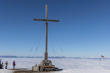 Two hiker on peak of The Schoeckl ( Sch&ouml;ckl ), often also called Sch&ouml;ckel, is, with a height of 1445 m above sea level, the southernmost significant peak in the Graz Highlands.