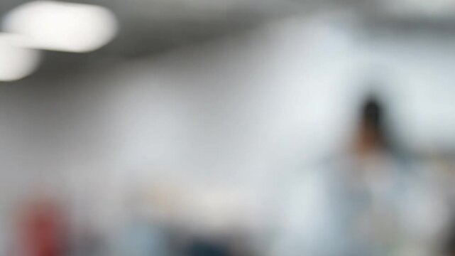 Blurred Ambience: A soft, indistinct scene of a workplace or public area, suggesting an atmosphere of subtlety and discretion.