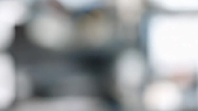 Abstract Cityscape: A blurred, evocative image of a bustling cityscape, showcasing the soft glow of lights and the undefined forms of structures in a display of urban energy.