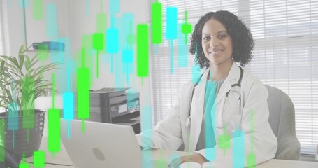 Doctor in lab coat reading candlestick chart on laptop in clinic, with stethoscope, copy space