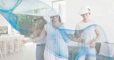 Wearing white VR headsets trio with center woman in blue dress exploring open kitchen with mesh