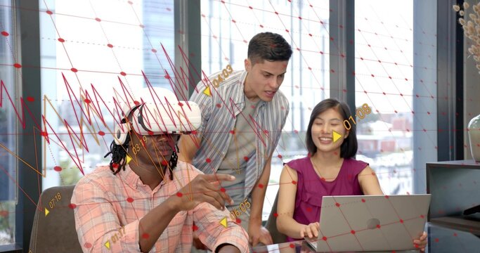 Gesturing VR-headset woman and team discussing silver laptop in modern office with red AR overlays - Powered by Adobe