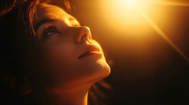 A dreamy portrait of a person gazing upward with soft glowing light symbolizing hopeful idealization and aspiration