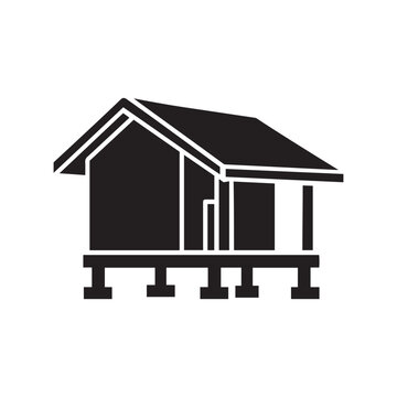 Minimalist black icon of an elevated cabin on stilts, simple architectural glyph representing sustainable housing and off-grid living.
