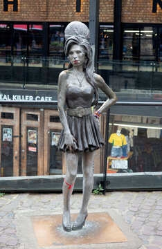 LONDON, UK - APRIL 27, 2019:  Statue of Amy Winehouse (by Scott Eaton) in Camden Stables Market