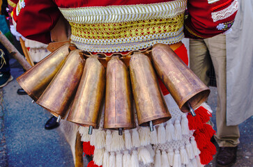Close up of Large Brass Cowbells on a Carnival Costume