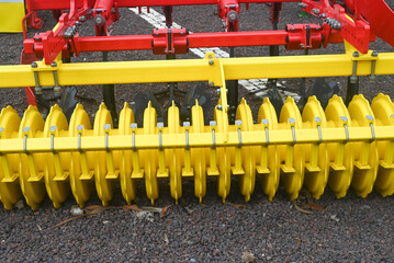 Close Up of Yellow Disc Harrow for Soil Preparation The Concept of Farm Machinery