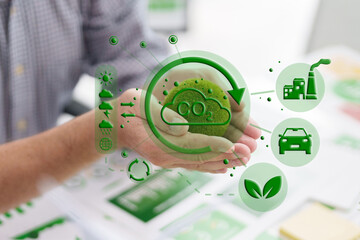 Man holds CO2 reduction icon for corporate ESG strategy carbon neutral goal using green technology for sustainable future development environment esg sustainability