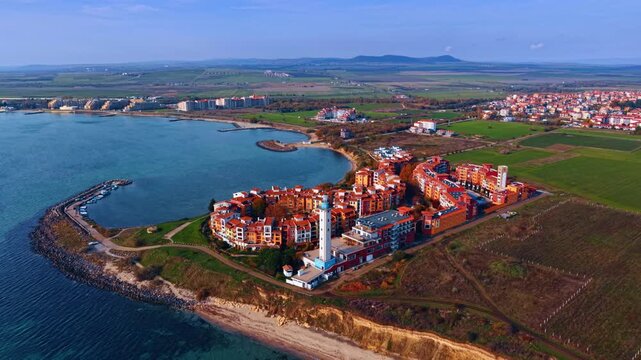 Spectacular colorful hotel complex Marina Cape at the Black Sea shore. Drone footage over the cityscape of Aheloy, Bulgaria.