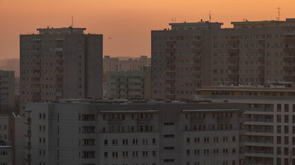 Fototapeta premium Urban Apartment Silhouettes at Winter Sunset