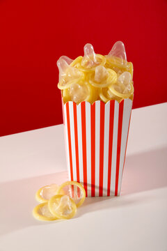 Creative concept of condoms in a popcorn box