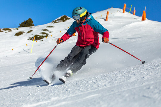 Skiing down a snowy mountain in the Pyrenees