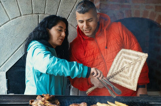 Young adults enjoying outdoor barbecue together