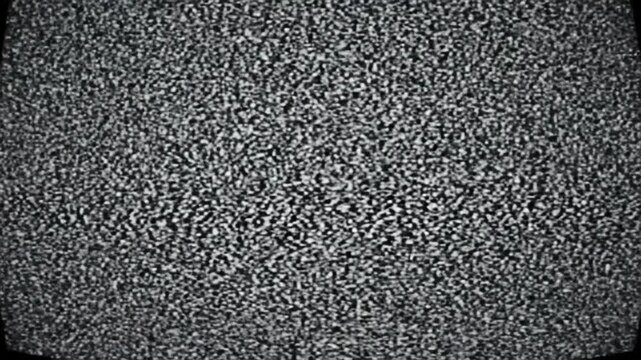 Abstract monochrome static-like noise fills the screen in shades of black, white, and gray