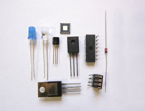 Electronic components on the table. Semiconductor elements: Transistors, integrated circuits, diodes.
