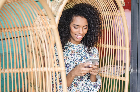 Woman enjoying leisure time on her smartphone