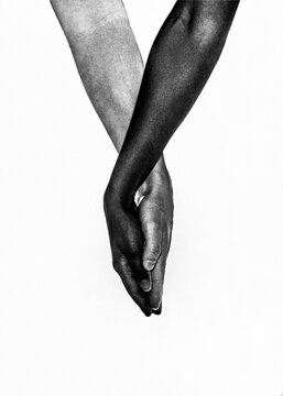 Interracial hands holding in unity and love