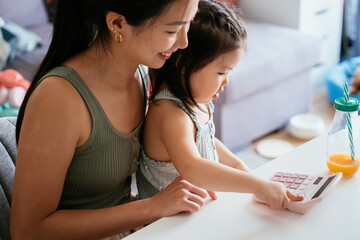 Mother and child bonding over learning at home