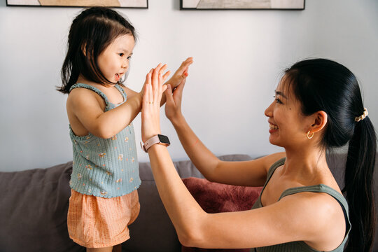 Mother and daughter playing with joy and connection