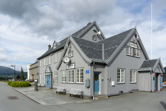 OPPDAL, NORWAY - AUGUST 06, 2021: Historic Oppdal Train Station Exterior with Slate Roof - Traditional Norwegian Railway Architecture