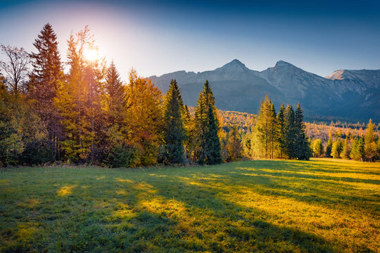 Marvelous autumn sunset in High Tatras (Vysoke Tatry) mountains. Exciting evening view of two peaks - Zdiarska Vidla and Havran, slovakia, Europe. Beauty of nature concept background.