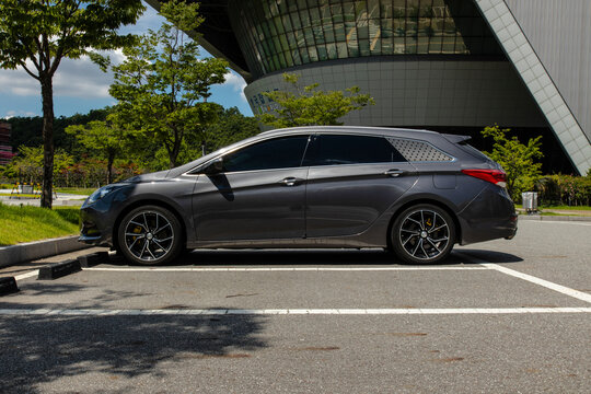 September 7, 2021, Seoul, South Korea - A dark grey Hyundai i40 wagon parked in an outdoor parking lot in front of the Dongdaemun Design Plaza.