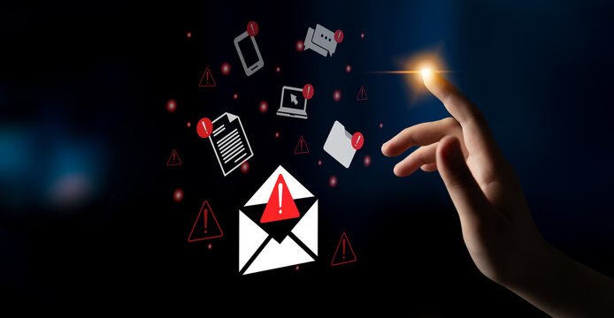 A visual representation of digital threats with a hand reaching for warning symbols surrounding an email icon, emphasizing the importance of cybersecurity awareness. Gantry - Powered by Adobe