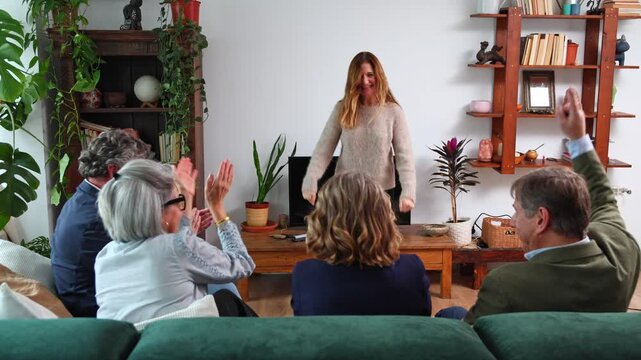 Happy family playing charades together at home