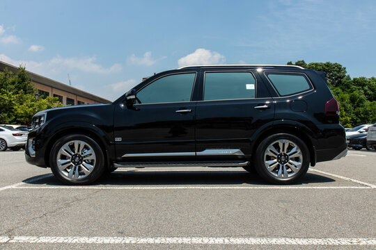 July 7, 2021, Seoul, South Korea - Black Kia Mohave SUV parked in an outdoor lot