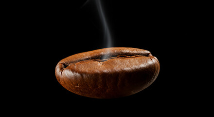Steaming roasted coffee bean on dark background