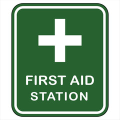 Fototapeta premium Green First Aid Station Sign with White Cross medical