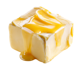 Soft yellow cube of creamy butter is drizzled with sweet golden honey, which melts and drips down the sides in a delicious and appetizing macro food photograph
