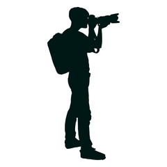 Photographer with backpack shooting silhouette