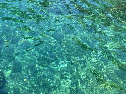 Clear emerald sea water surface.