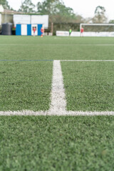 Soccer field with artificial turf and white lines