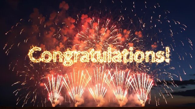 Fireworks exploding in the night sky with congratulations message