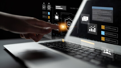 A hand reaches toward a laptop screen displaying a digital interface with artificial intelligence concepts, enhancing user interaction with technology and data security. Gantry