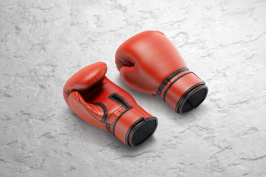 Blank red boxing gloves pair mockup lying, grey surface background