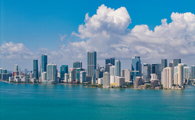 Naklejka premium Famous landmarks of Miami Brickell from above. Drone view of the Brickell in Miami city. Business in Brickell district. Biscayne Bay Florida iconic urban coastline in daylight.