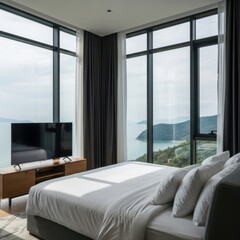 Modern bedroom with a large window overlooking a scenic ocean view, featuring a comfortable bed and a television
