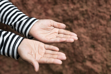 A little girl open empty hands