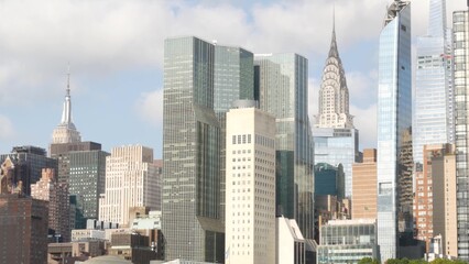 Fototapeta premium New York City Manhattan Midtown skyline from Roosevelt Island, United States. Skyscraper building architecture, riverside cityscape, East River. Turtle Bay district high-rise towers, business center.