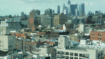 Fototapeta premium New York City Manhattan Midtown cityscape, Hudson Yards from rooftop on Bowery street, United States of America. Buildings architecture, water tower tanks on roof. Aerial view of residential district.
