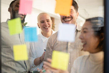 Diverse business team collaborating during brainstorming with sticky notes