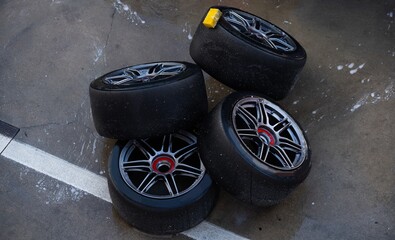 Detail of a stack of tires with tires for racing cars, they are in the back of the team truck