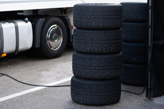 Detail of a stack of tires with tires for racing cars, they are in the back of the team truck