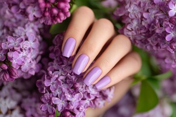 Woman Touches Lilac Flowers With Purple Nails During Spring Season in a Garden Setting