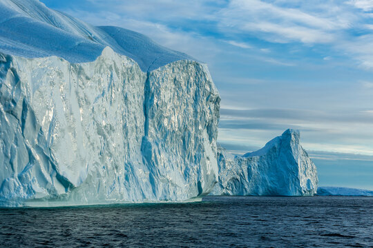 Massive Iceberg Wall During Midnight Sun in Disco Bay Near Ilulissat, Greenland, Arctic