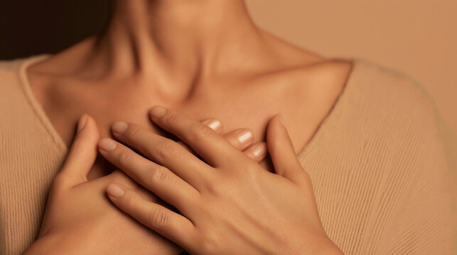 Woman placing hands on chest, finding peace feeling calm, expressing self love through mindful breathing