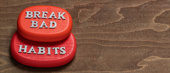 Break bad habits words on red wooden blocks. Motivation and self-development concept. Banner with empty space for additional concept.
